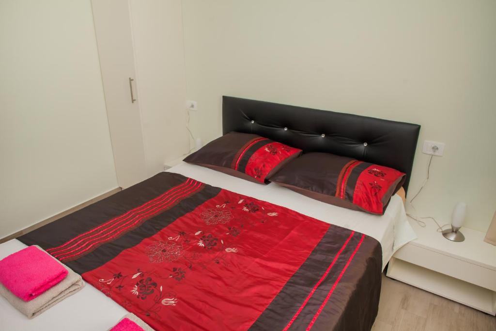 Postel nebo postele na pokoji v ubytování Apartments Villa Matea