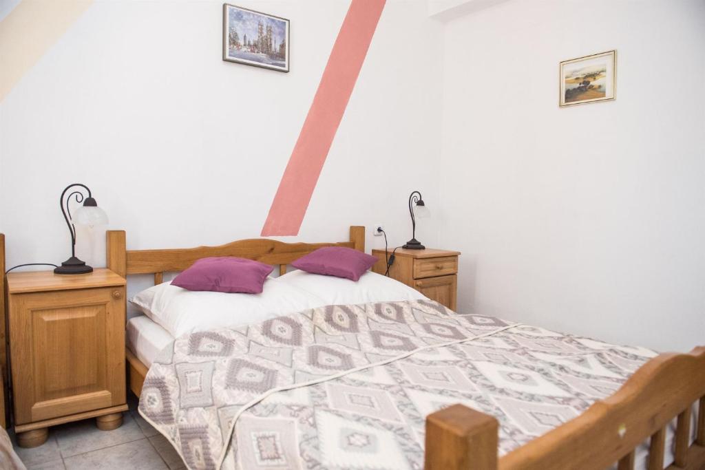 Posteľ alebo postele v izbe v ubytovaní Apartments Ljubica