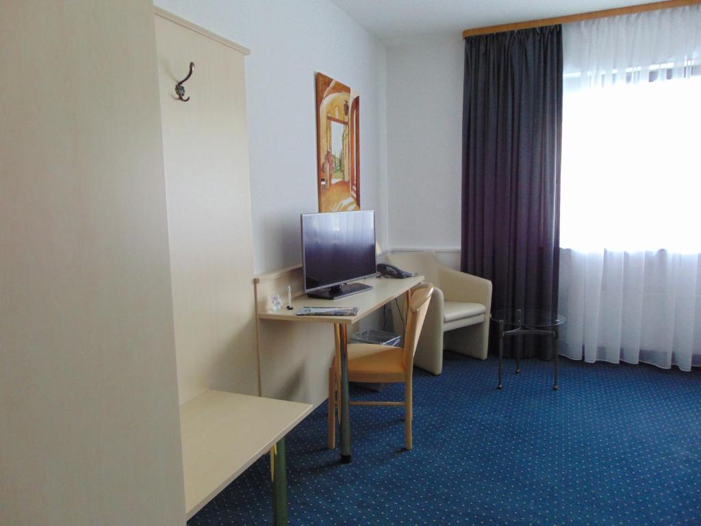 TV a/nebo společenská místnost v ubytování Hotel Restaurant Molitor