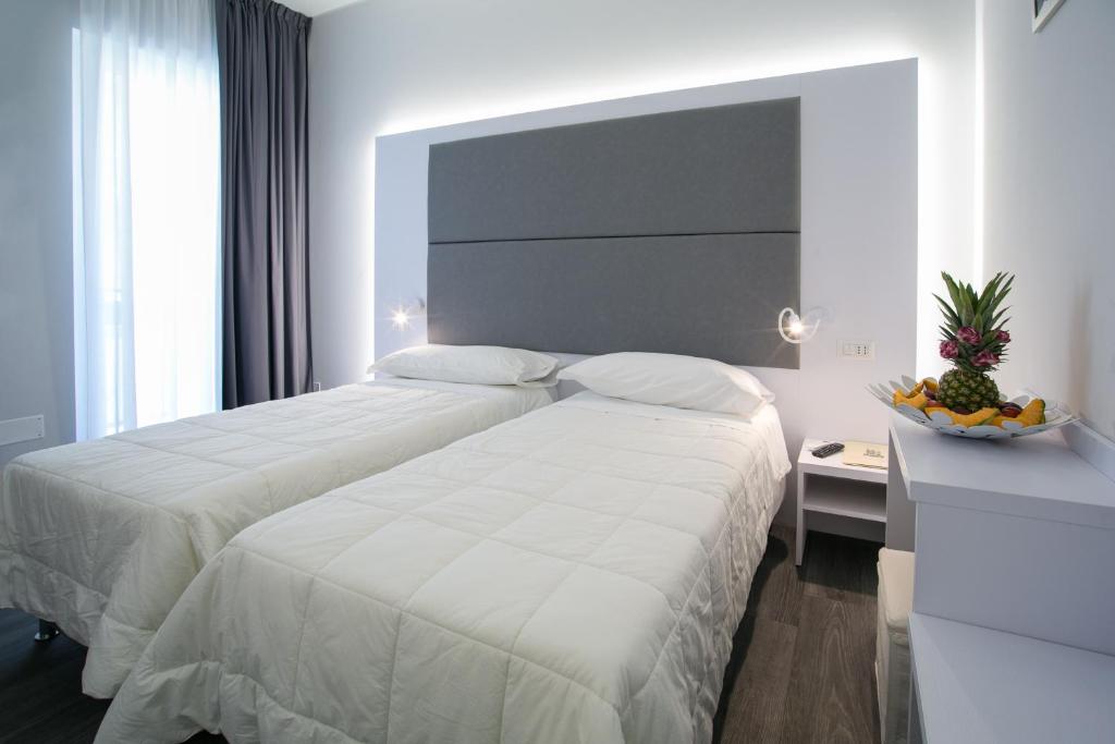 Postel nebo postele na pokoji v ubytování Hotel La Torraccia