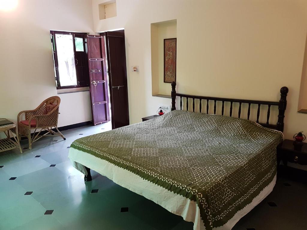 Postel nebo postele na pokoji v ubytování Krishna Ranch