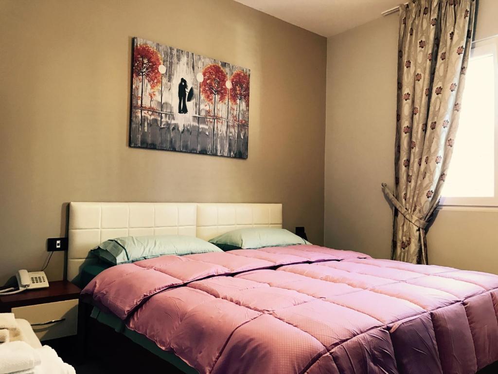 Postel nebo postele na pokoji v ubytování Vila Ada Hotel