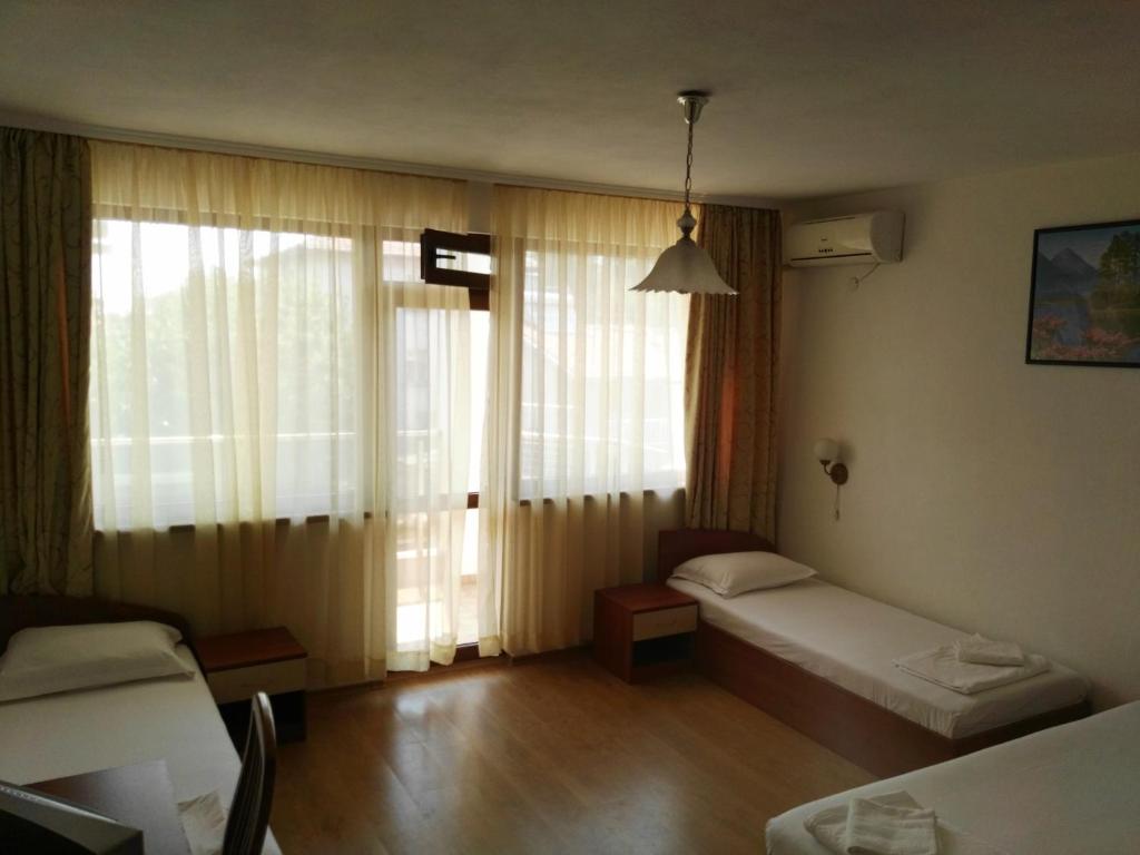 Postel nebo postele na pokoji v ubytování Villa Diana Self check-in