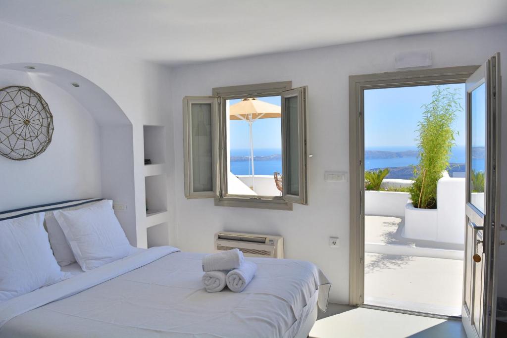 Postel nebo postele na pokoji v ubytování Cocoon Suites