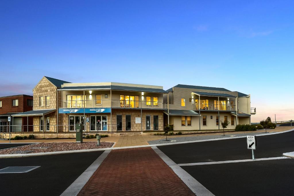 a building on the corner of a street at Robe Marina Accommodation in Robe