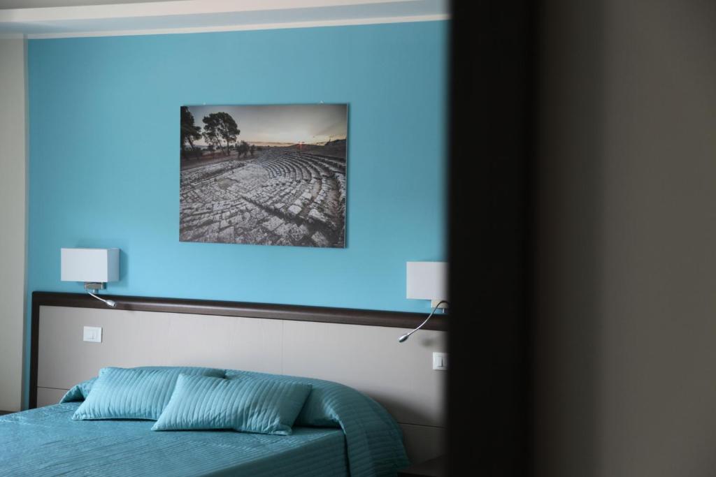 Postel nebo postele na pokoji v ubytování Sud Est Guest House