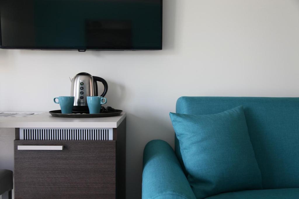 TV a/nebo společenská místnost v ubytování Sud Est Guest House