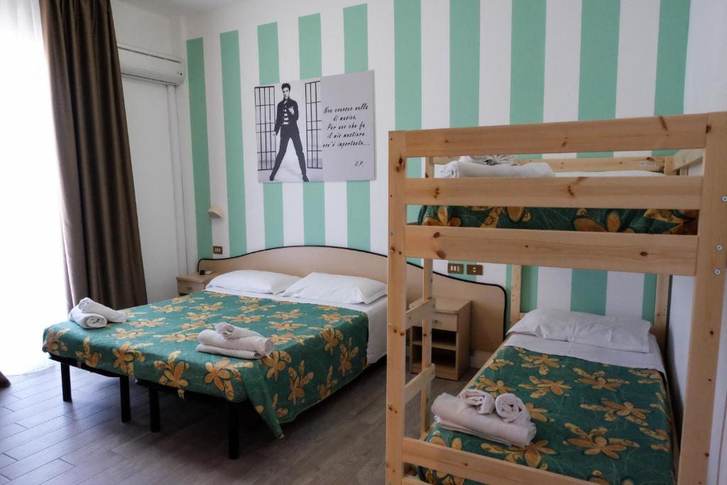Postel nebo postele na pokoji v ubytování Beach Hotel Clerice