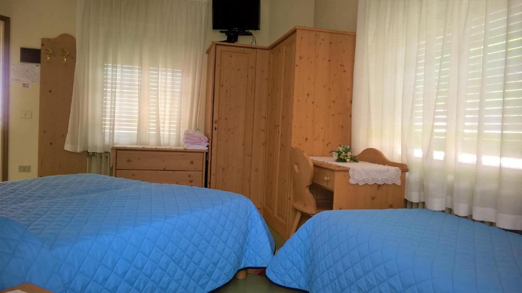 Postel nebo postele na pokoji v ubytování Hotel Zoldana