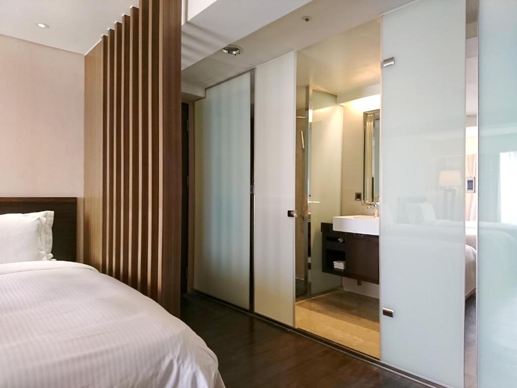 Postel nebo postele na pokoji v ubytování Century Hotel Taoyuan
