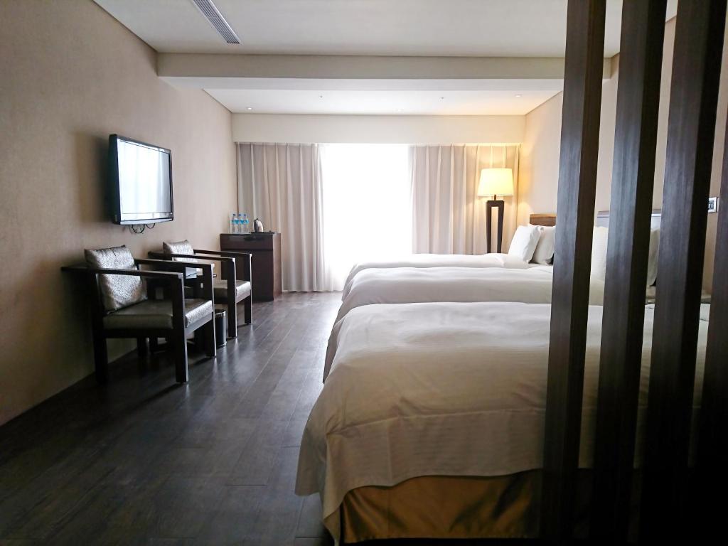 Postel nebo postele na pokoji v ubytování Century Hotel Taoyuan