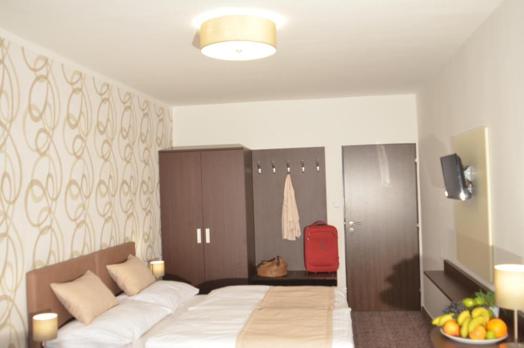 Postel nebo postele na pokoji v ubytování Hotel Atlas