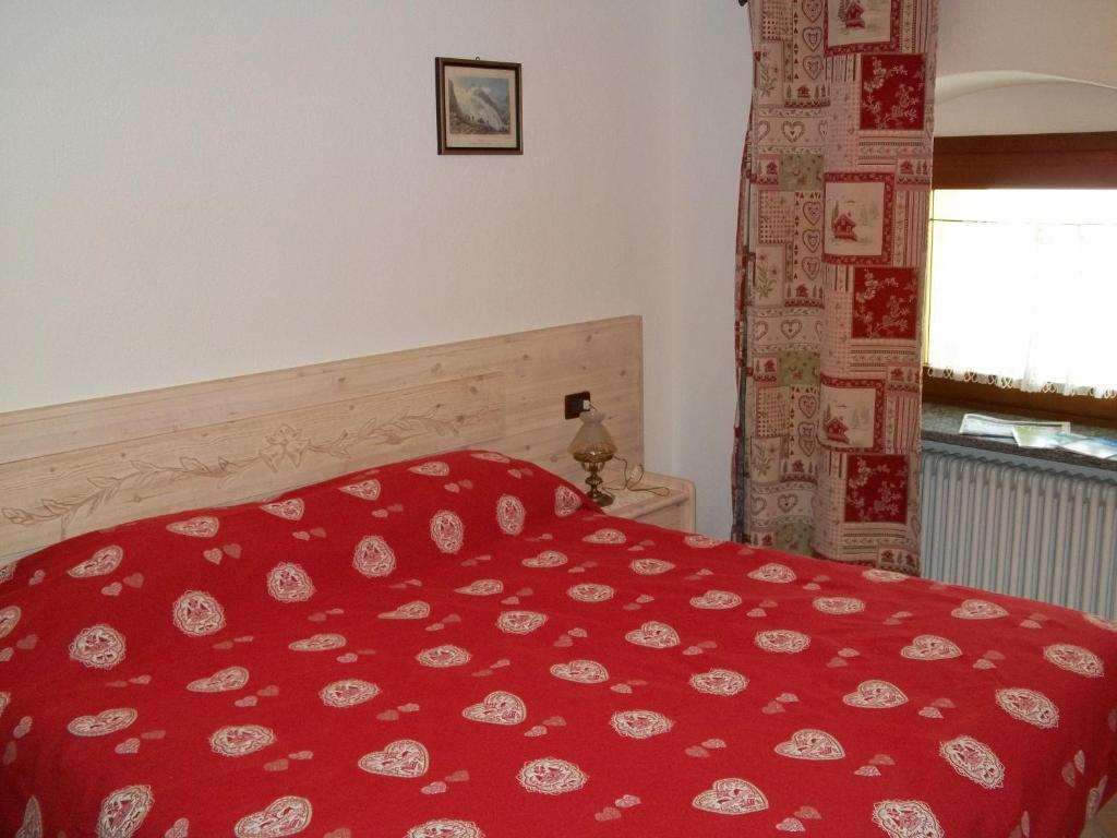 Postel nebo postele na pokoji v ubytování Affittacamere Chez Magan