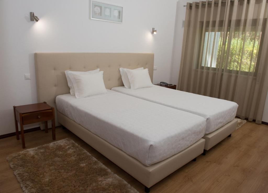 Postel nebo postele na pokoji v ubytování Hotel S. Jorge