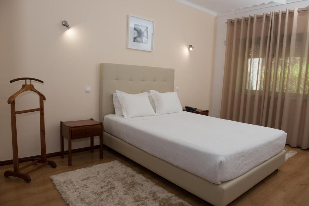 Postel nebo postele na pokoji v ubytování Hotel S. Jorge