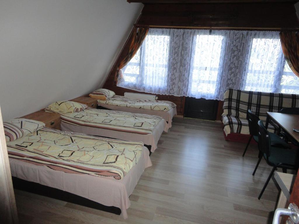 Postel nebo postele na pokoji v ubytování O.W.S. Strzecha
