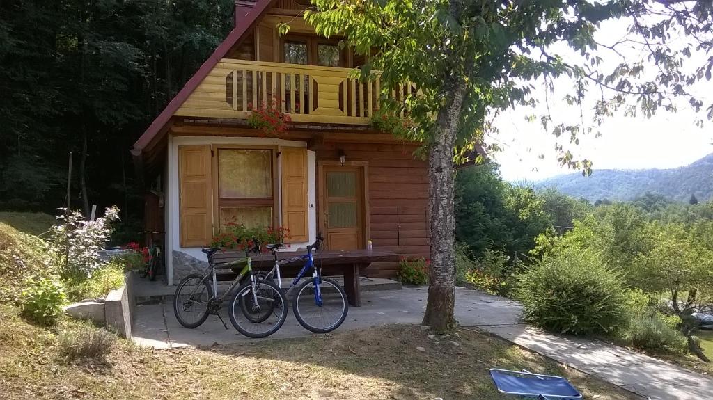 a couple of bikes parked in front of a house at Holiday Home Vesna in Brod na Kupi