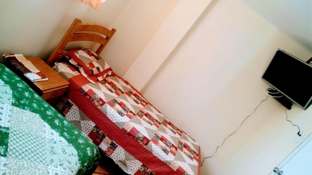 Cama o camas de una habitación en Hospedaje Julito