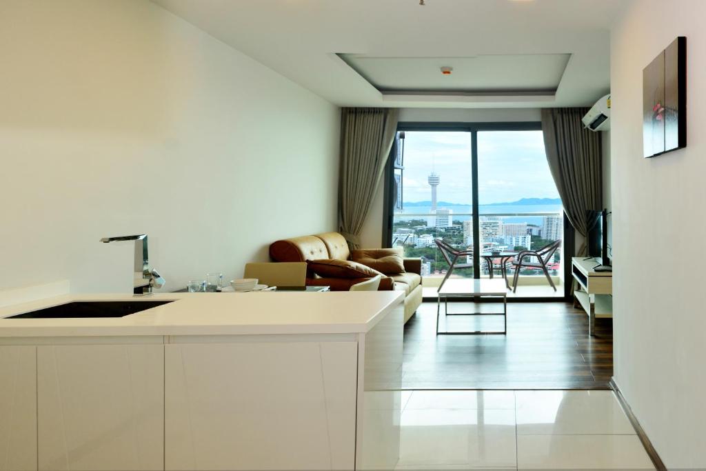 a kitchen and living room with a view at Peak Towers Condominium in Pattaya South