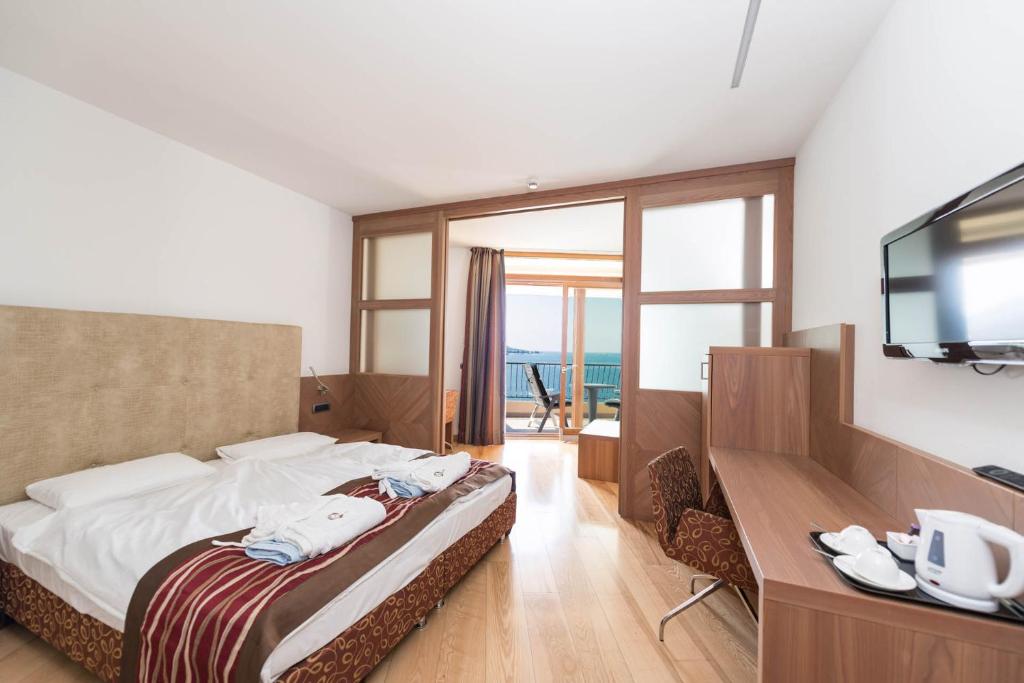 Postel nebo postele na pokoji v ubytování Hotel Baia Verde