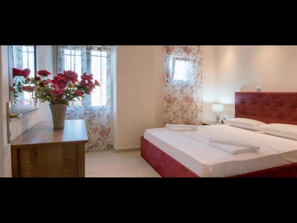 מיטה או מיטות בחדר ב-Namare Luxury Apartments