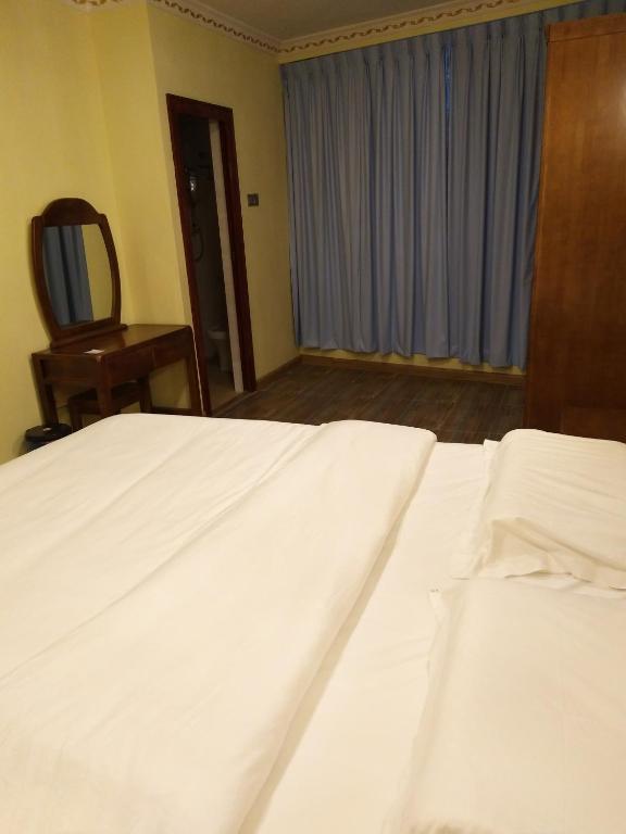 Postel nebo postele na pokoji v ubytování Uncle Ho Motel