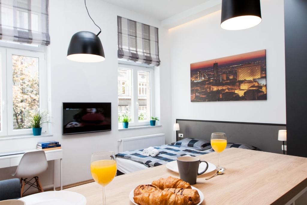 TV a/nebo společenská místnost v ubytování LOOX apartments Hatzova