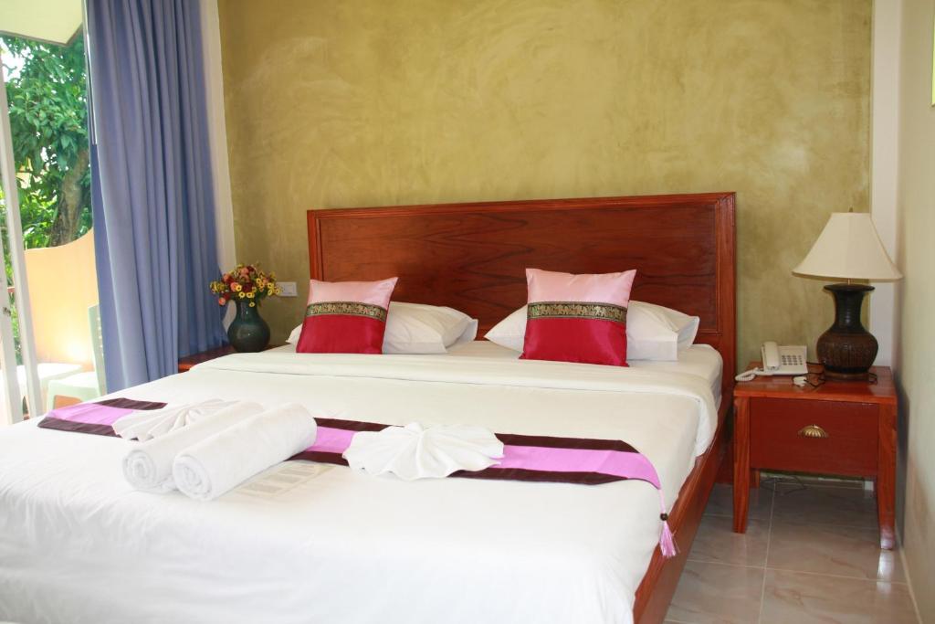 Postel nebo postele na pokoji v ubytování Baan Vanida Garden Resort