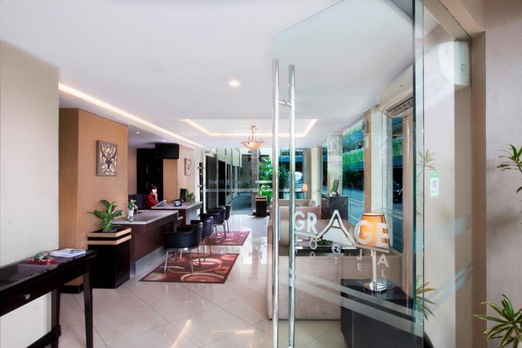 a lobby of a salon with a barber shop at Grage Jogja Malioboro in Yogyakarta