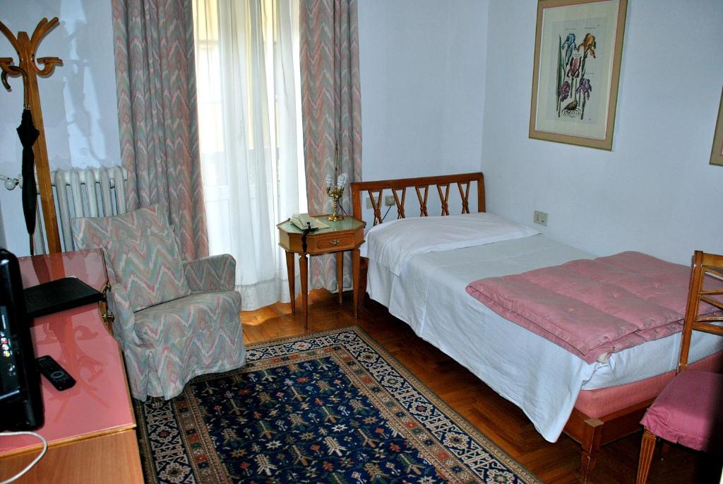 Кровать или кровати в номере Hotel De La Poste