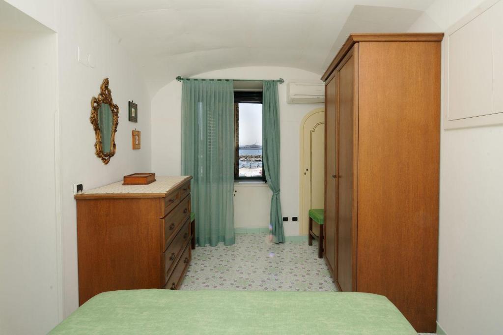 A bed or beds in a room at That's Atrani, Amalfi Coast beach front apartment
