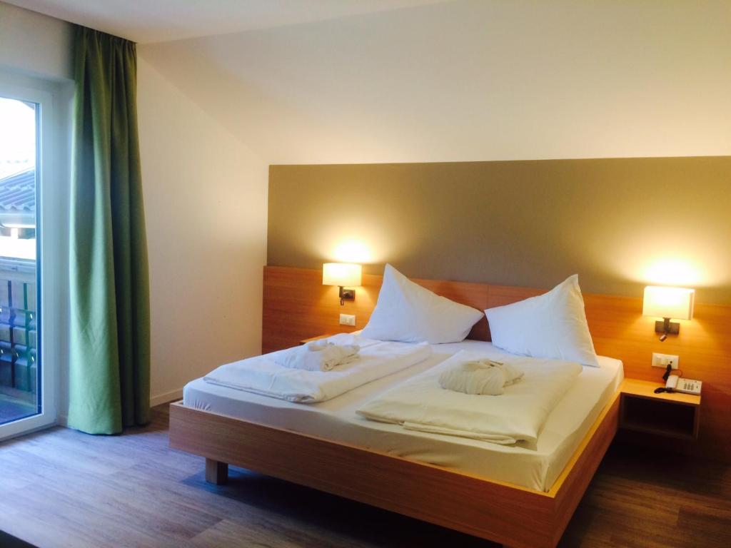 Postel nebo postele na pokoji v ubytování Hotel Gerstgras