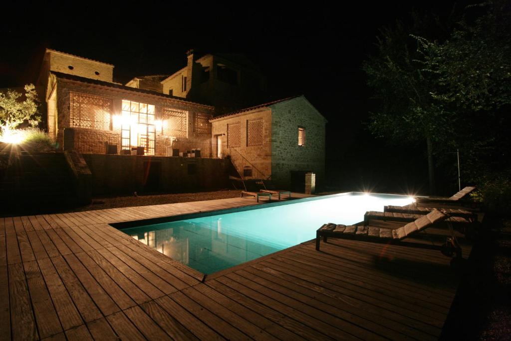 a swimming pool in a yard at night at Relais Azienda Casalino in Toppole