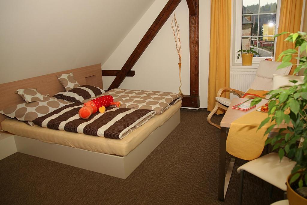 Postel nebo postele na pokoji v ubytování Penzion a relax centrum Andělka