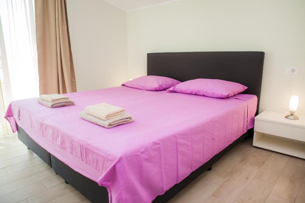 Postel nebo postele na pokoji v ubytování Apartments Villa Matea