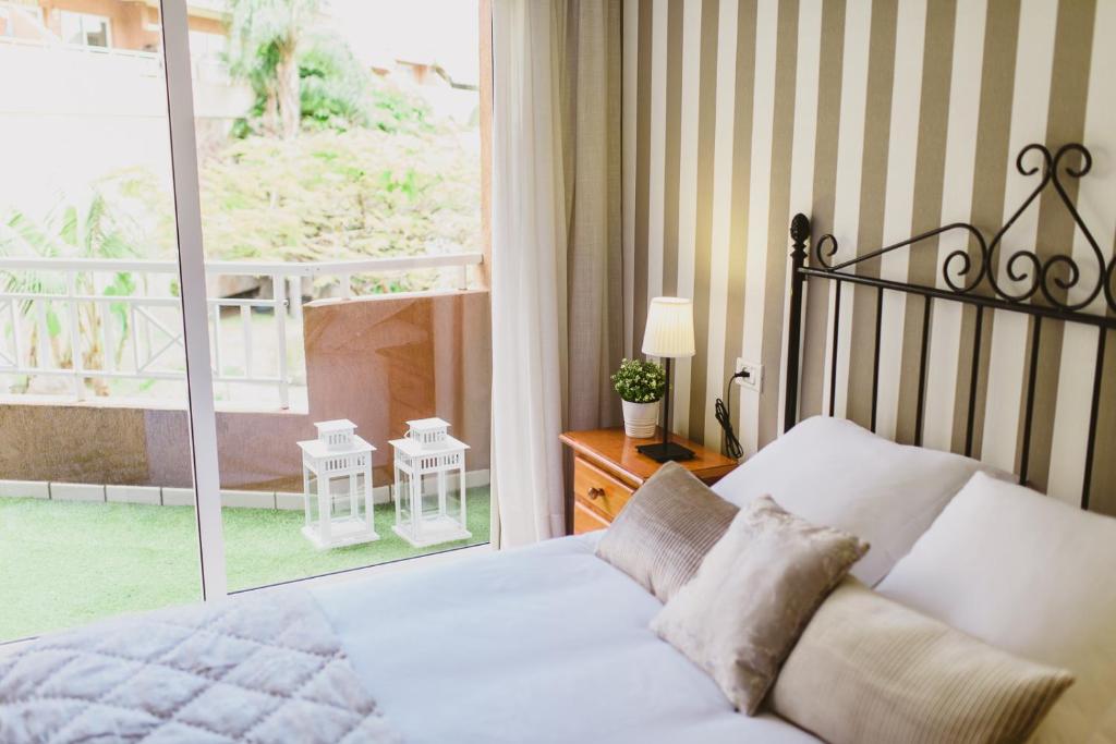 سرير أو أسرّة في غرفة في Vista Paraíso - La Asomada