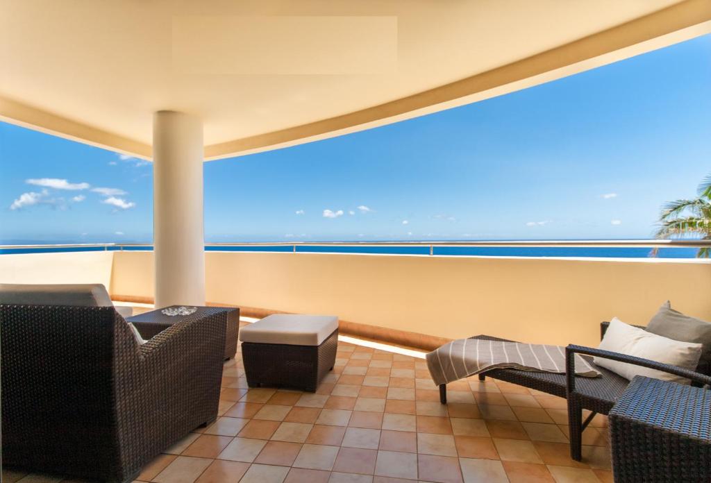 a balcony with a view of the ocean at 6001 by RMC in Funchal