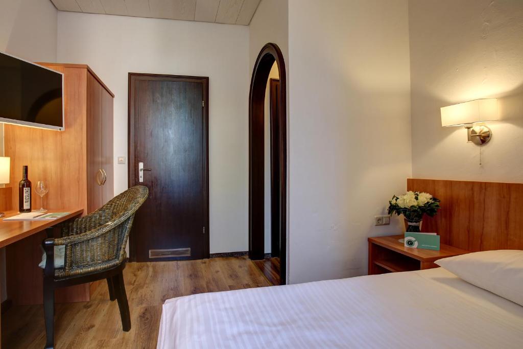 Postel nebo postele na pokoji v ubytování Trip Inn Hotel Blankenburg
