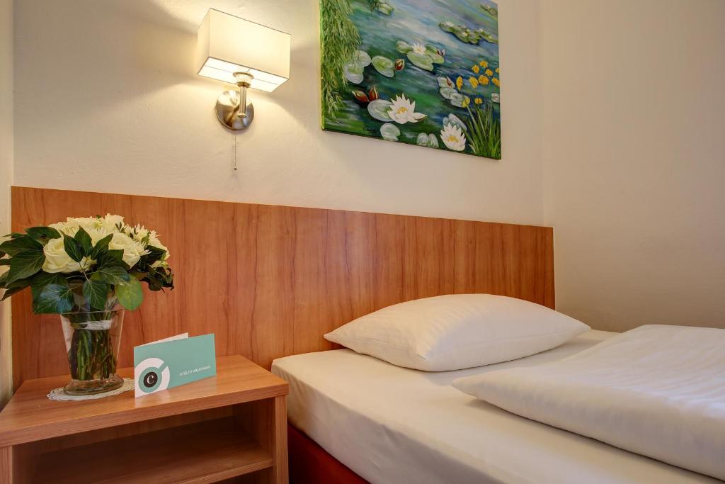 Postel nebo postele na pokoji v ubytování Trip Inn Hotel Blankenburg