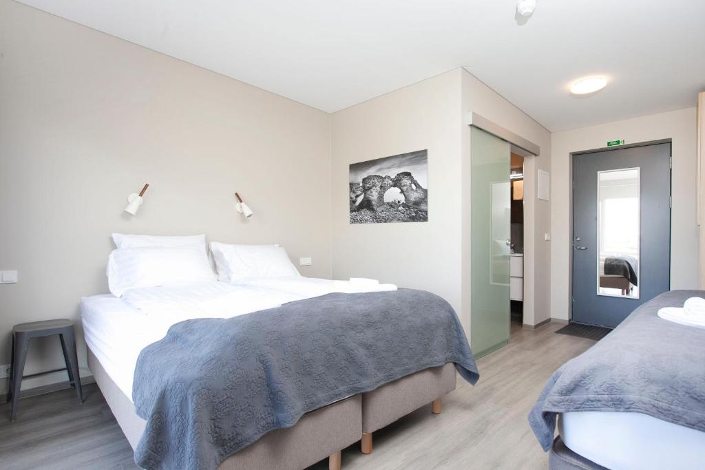 Voodi või voodid majutusasutuse Arnarstapi Hotel toas
