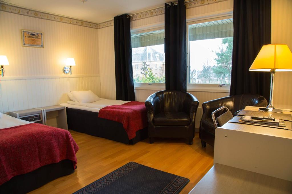 Postel nebo postele na pokoji v ubytování Dinners Mellerud