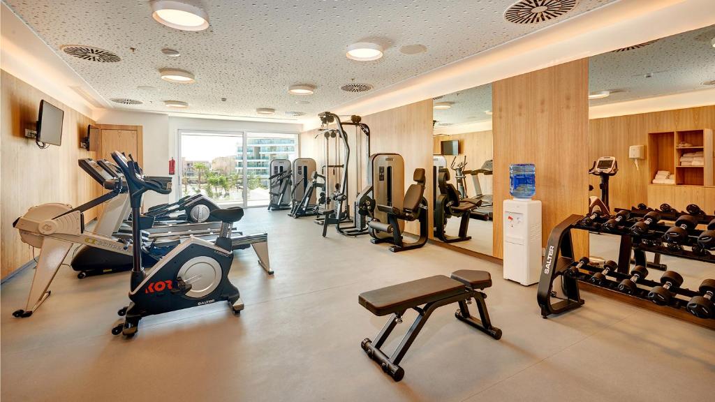 a gym with treadmills and machines in a room at Hipotels Playa de Palma Palace&Spa in Playa de Palma