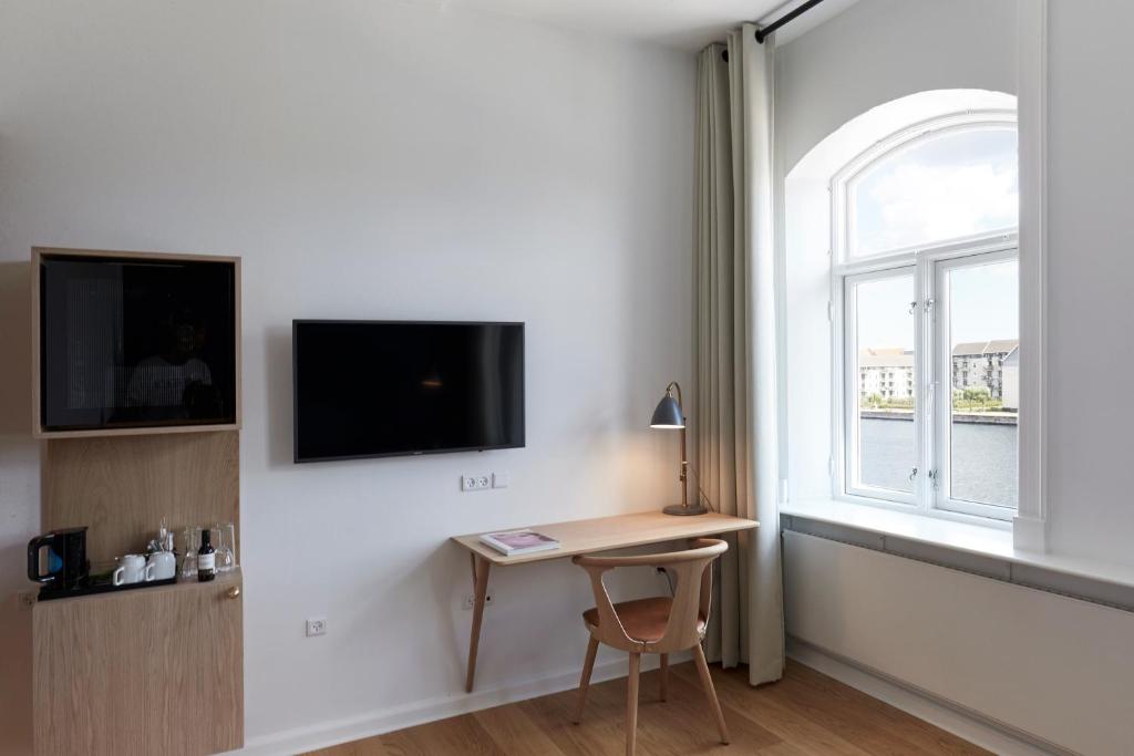 TV a/nebo společenská místnost v ubytování Copenhagen Strand