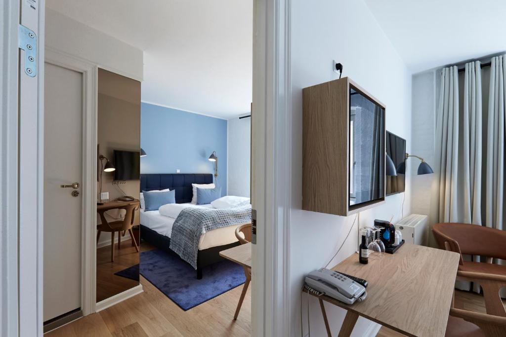 Postel nebo postele na pokoji v ubytování Copenhagen Strand