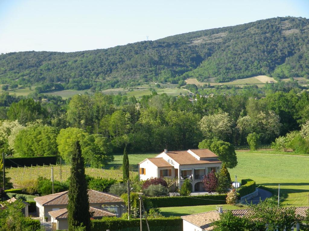 a house with a view of a mountain at Au mas des graviers in Salavas