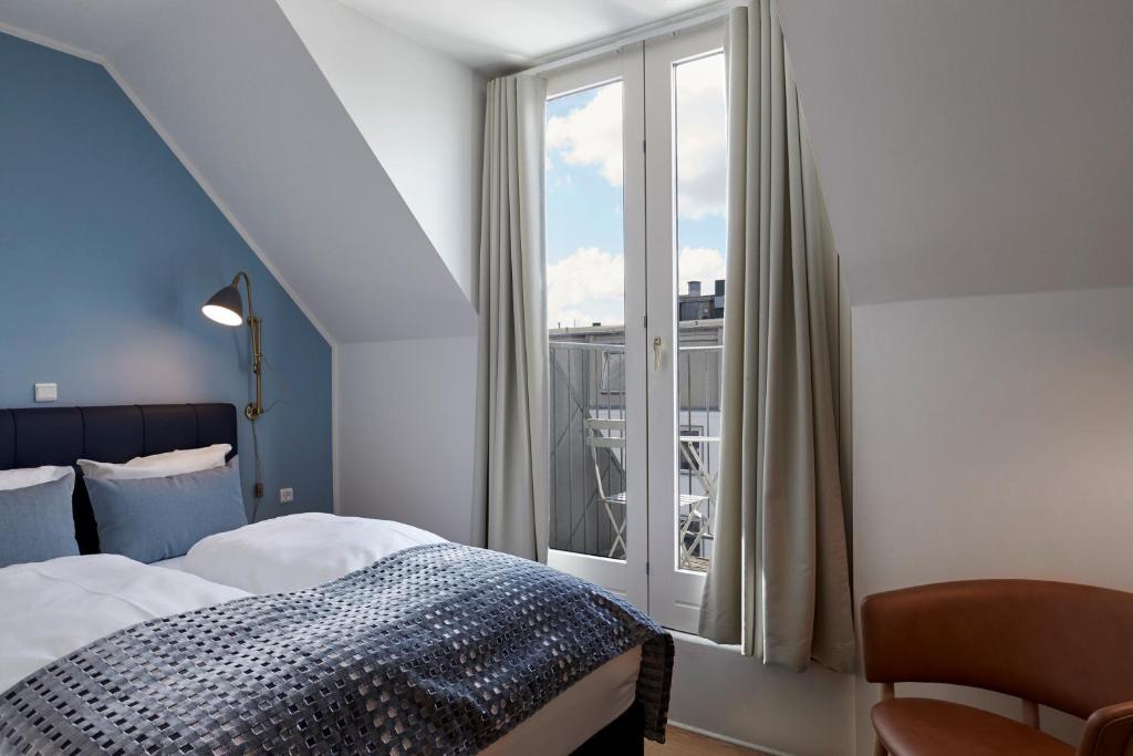 Postel nebo postele na pokoji v ubytování Copenhagen Strand