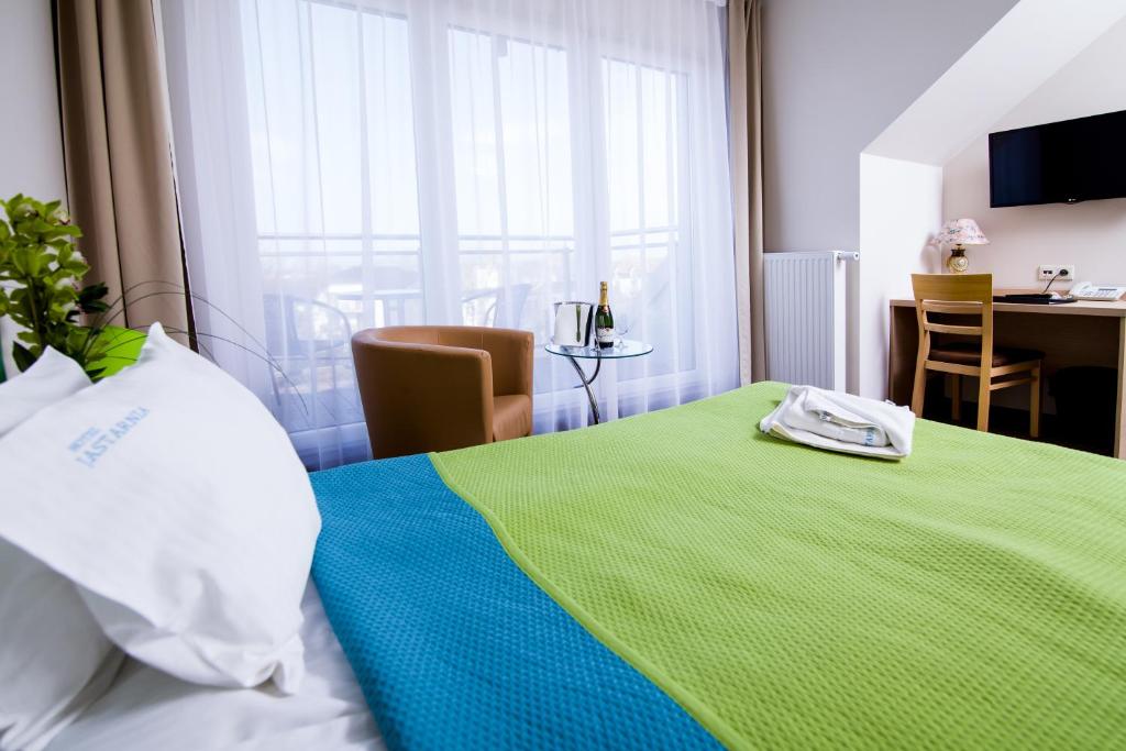 Postel nebo postele na pokoji v ubytování Hotel Jastarnia