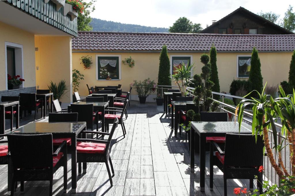 a row of tables and chairs on a patio at Gasthof-Hotel Dilger in Rattenberg