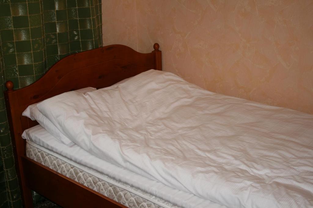 Postel nebo postele na pokoji v ubytování Yulia Apartment