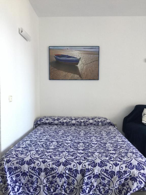 Postel nebo postele na pokoji v ubytování Estudios y Apartamentos Benal Beach